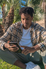 black afro american man with tablet in hand