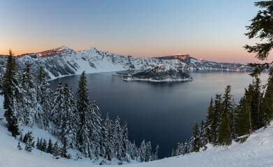 Beautiful sunset over Crater Lake in frost winter day. Crater Lake National Park, Oregon, USA