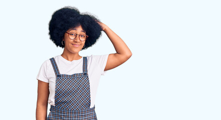 Young african american girl wearing casual clothes confuse and wonder about question. uncertain...