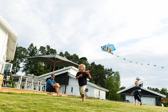 Children flying kite, Sweden