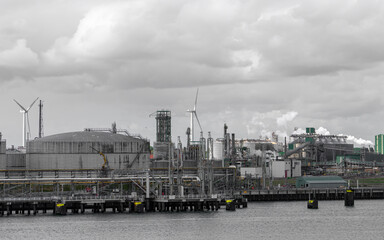 Fototapeta premium Industrial plant and cranes in the port of Rotterdam, Netherlands
