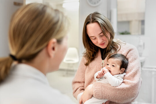 Mother with baby in doctor's office, Sweden