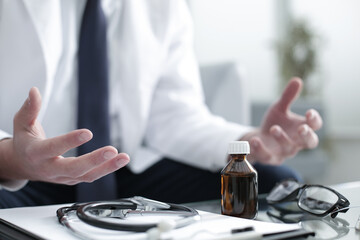 Doctor working in the clinic consults the patient
