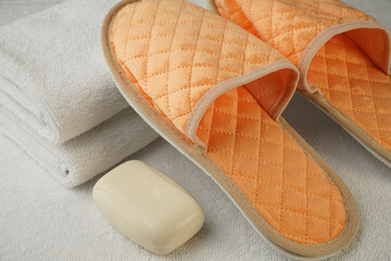white Terry towels with disposable Slippers and soap