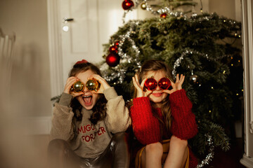 Girls in front of Christmas tree, Sweden