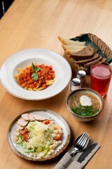 Set lunch in a cafe on wooden table, side top view