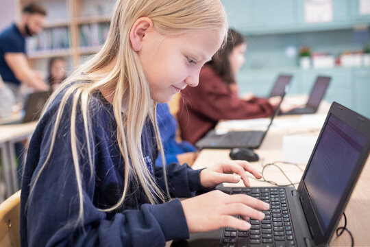 Girl In Classroom Using Laptop, Sweden