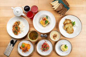 Meals variety on a wooden table directly above view