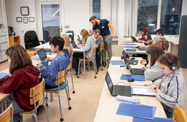 Children in classroom using laptops, Sweden