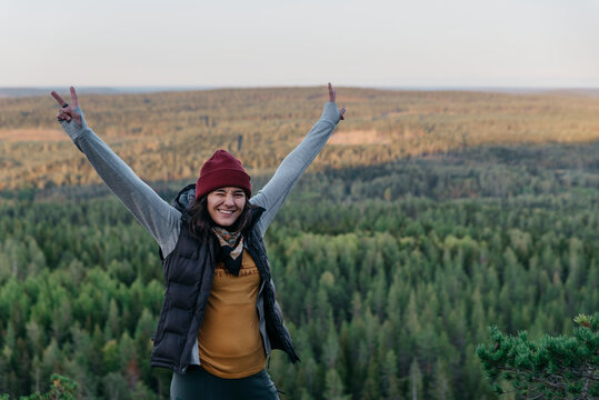 Happy hiker showing peace sign, Sweden