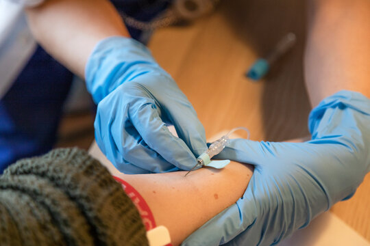 Nurse is taking blood of patient, Sweden