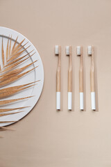 Wooden Toothbrush. Zero waste. Tooth Brushes Scattered on Table. Collection of Elegant Ecological Clear Healthcare Bath Accessory for Clean Teeth