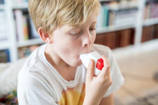 Boy using inhaler, Sweden
