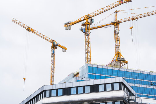 Building cranes on construction site, Sweden