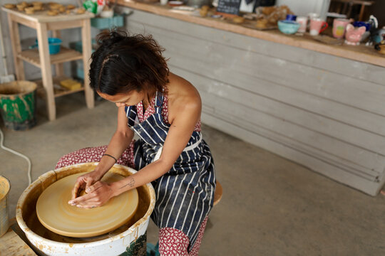 Woman using potters wheel, Sweden