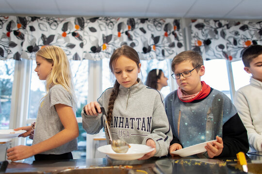 Children choosing food in school canteen, Sweden