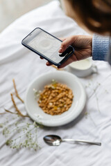 plate with breakfast on a white bed with flowers