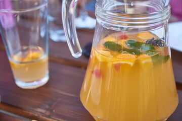 Serving fresh lemonade in a jug in a restaurant