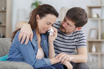 a man calming his distressed wife