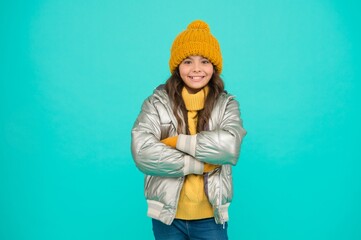 Warm smiles. teenage girl in silver puffer jacket. trendy warm clothing. happy childhood. accessories shop for kids. enjoy weather on christmas holidays. smiling stylish child. autumn season fashion