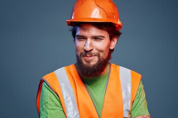 Bearded man in orange paint construction safety hard work