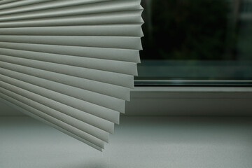 Obraz premium Fragment of paper blinds for Windows