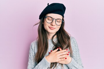 Young beautiful caucasian girl wearing french look with beret smiling with hands on chest, eyes closed with grateful gesture on face. health concept.