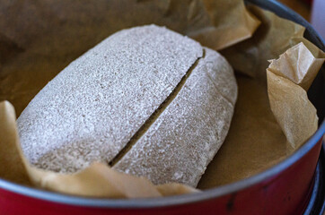 A scored unbaked sourdough bread