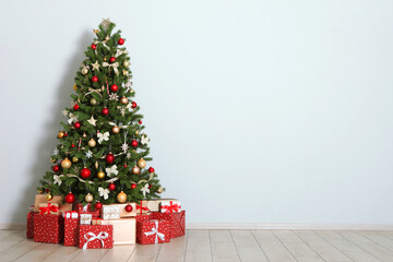 Beautiful interior decorated for Christmas or New Year. Christmas tree and gifts. Place for text