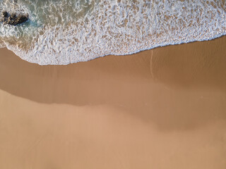 Beach shore wave top view aerial drone shot