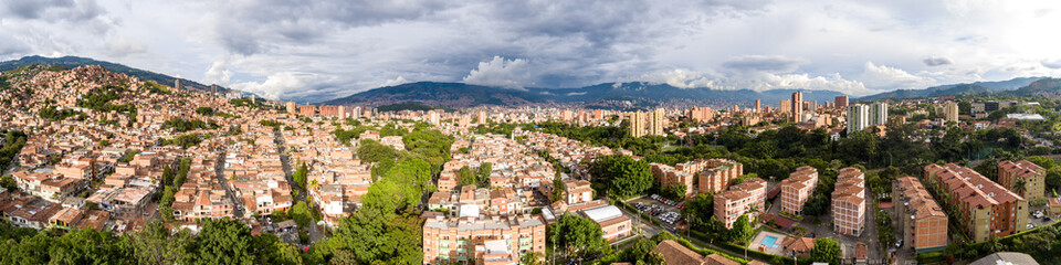 Fototapeta na wymiar Aerial Panoramic View of Many Condominiums, High-Rise Buildings in the Mountains