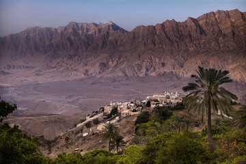 Fototapeta na wymiar View of a village of mud houses near the mountains 