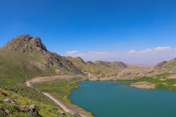 View of a lake in mountains. Hakkari cilo sat lakes, snowy mountains and natural scenery
