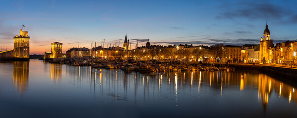 Panoramic view of the old harbor of La Rochelle at blue hour
