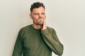 Handsome man with beard wearing casual clothes skeptic and nervous, frowning upset because of problem. negative person.