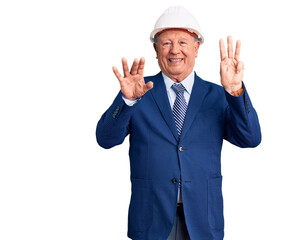 Senior handsome grey-haired man wearing suit and architect hardhat showing and pointing up with fingers number eight while smiling confident and happy.
