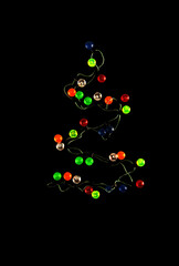 Alternative Christmas tree of garland against black background