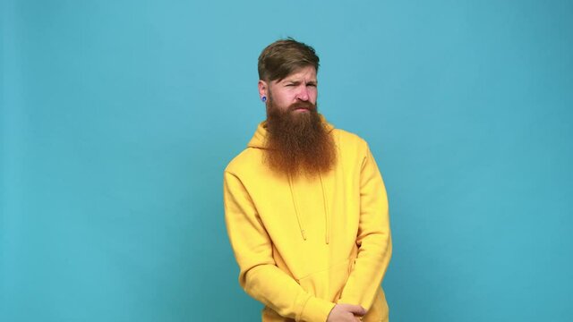 Young adult bearded caucasian man isolated confused, feels doubtful and unsure