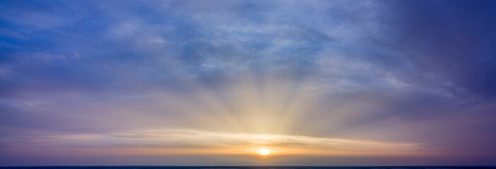 Dawn sky, sunbeams and dreams, morning panorama.