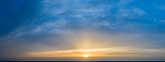 Dawn sky, sunbeams and dreams, morning panorama.