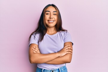 Obraz premium Young latin woman wearing casual clothes happy face smiling with crossed arms looking at the camera. positive person.