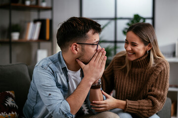 Young man having a problem. Girlfriend comforting her sad boyfriend.
