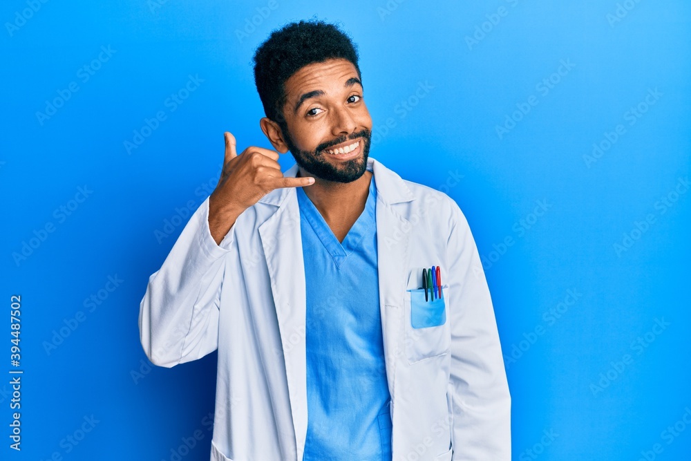 Canvas Prints Handsome young hispanic business man wearing doctor uniform making fish face with lips, crazy and comical gesture. funny expression.