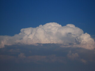 Close-up of a beautiful multi-colored sky with a cloud in its original form in autumn in Israel. Volumetric cloud, interesting design. There is room for text.