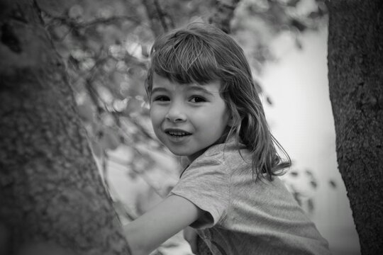 Close-up Portrait Of Cute Girl Amidst Trees