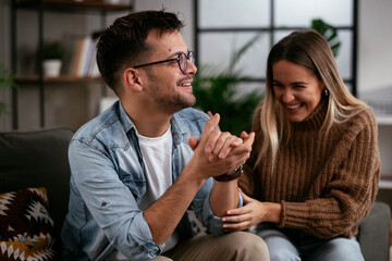 Young man having a problem. Girlfriend comforting her sad boyfriend.