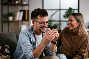 Young man having a problem. Girlfriend comforting her sad boyfriend.