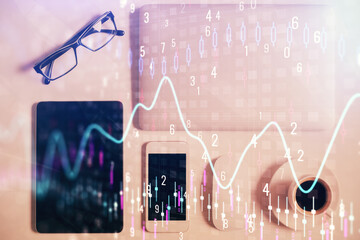 Multi exposure of financial chart hologram over desktop with phone. Top view. Mobile trade platform concept.