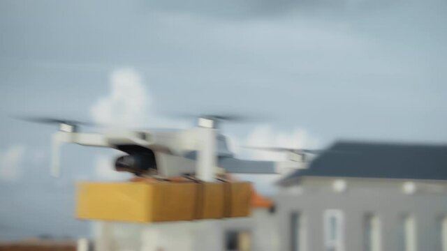 flying on a sky delivery drone with holding a .cardboard parcel
