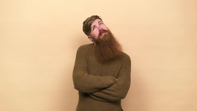 Young adult bearded caucasian man isolated confused, feels doubtful and unsure